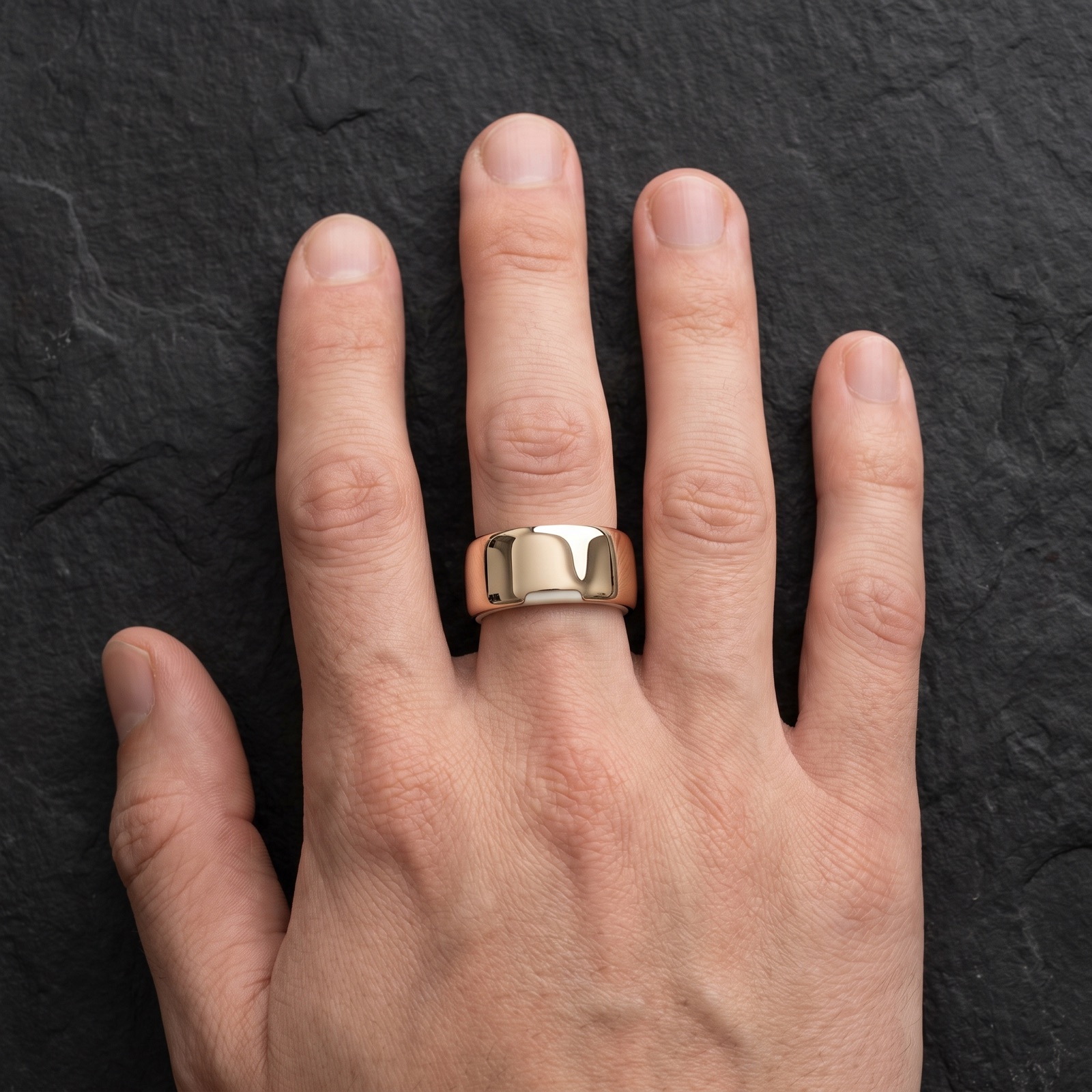 The Pulse ring in gold, worn on a hand